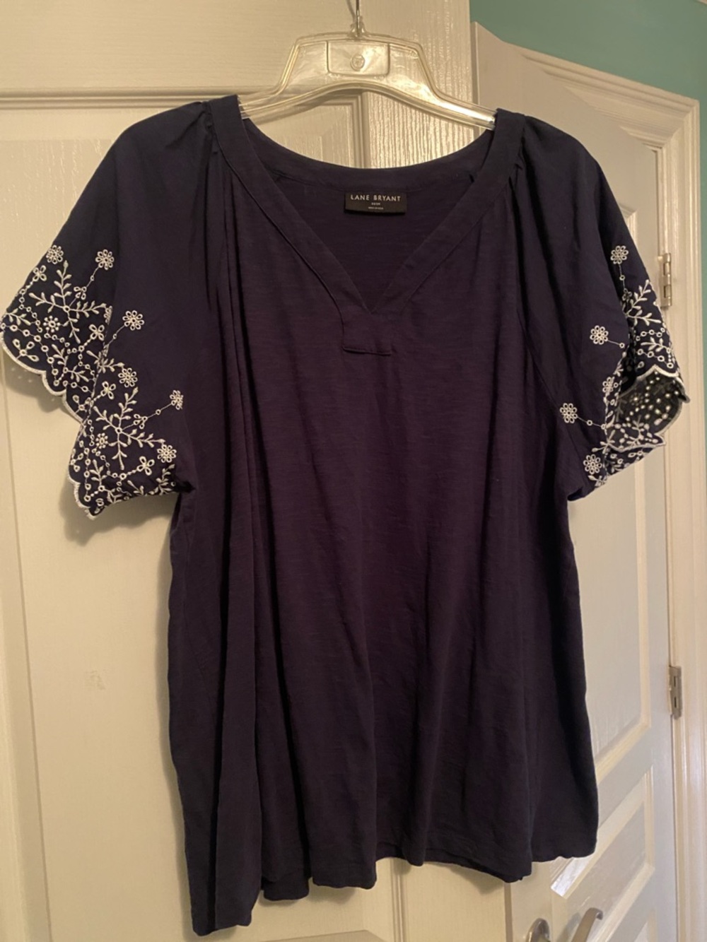 Lane Bryant Navy V‑Neck Top with White Embroidered Flutter Sleeves